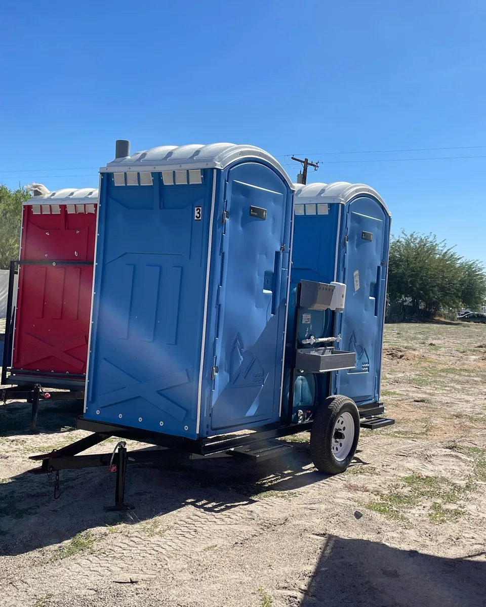 Portable toilets mounted on a small trailer